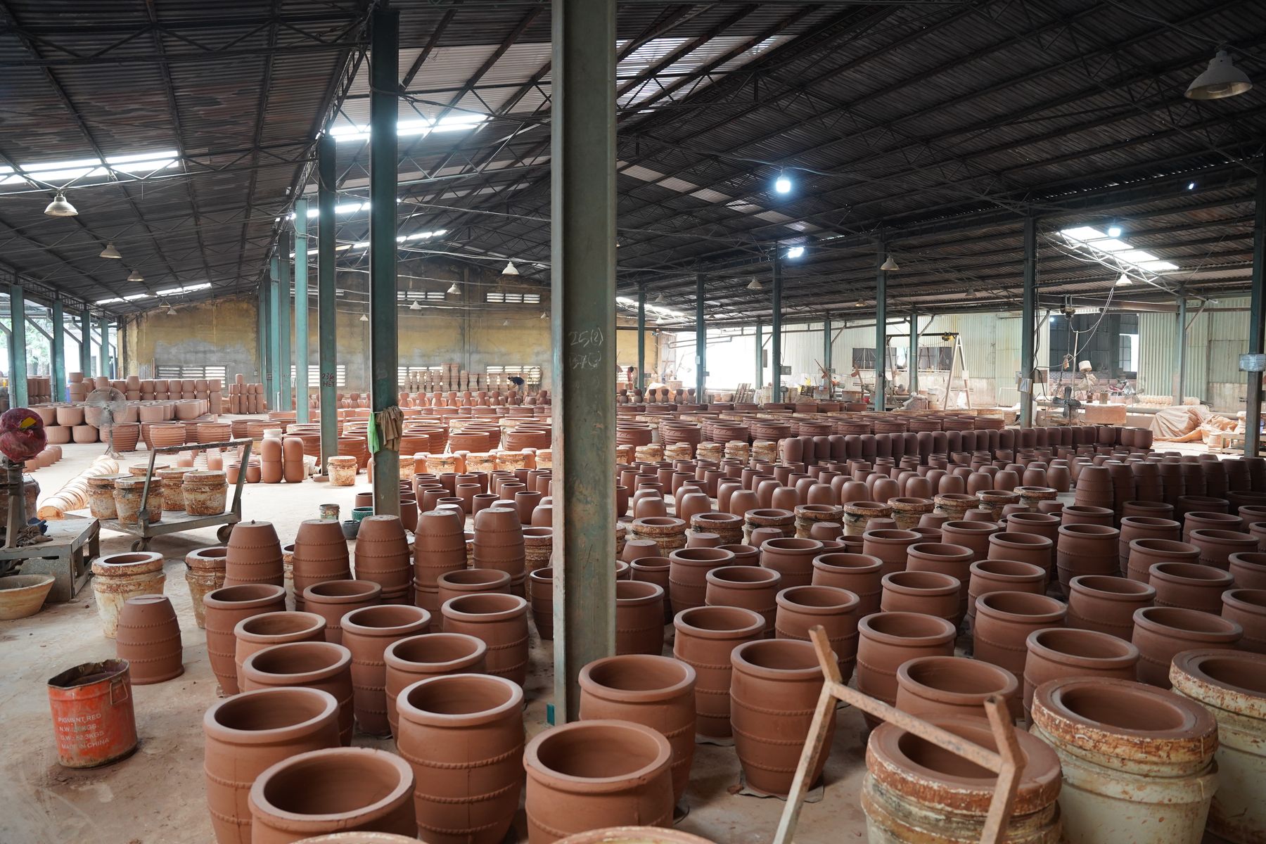Unfired pots stacked ahead of the dragon kiln, TNL & Son factory, Binh Duong, Vietnam