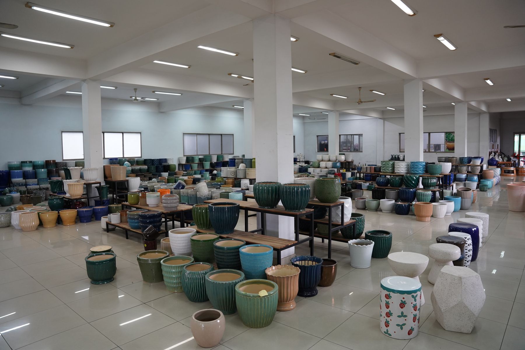 Showroom floor lined with finished glazed pots, TNL & Son factory, Binh Duong, Vietnam