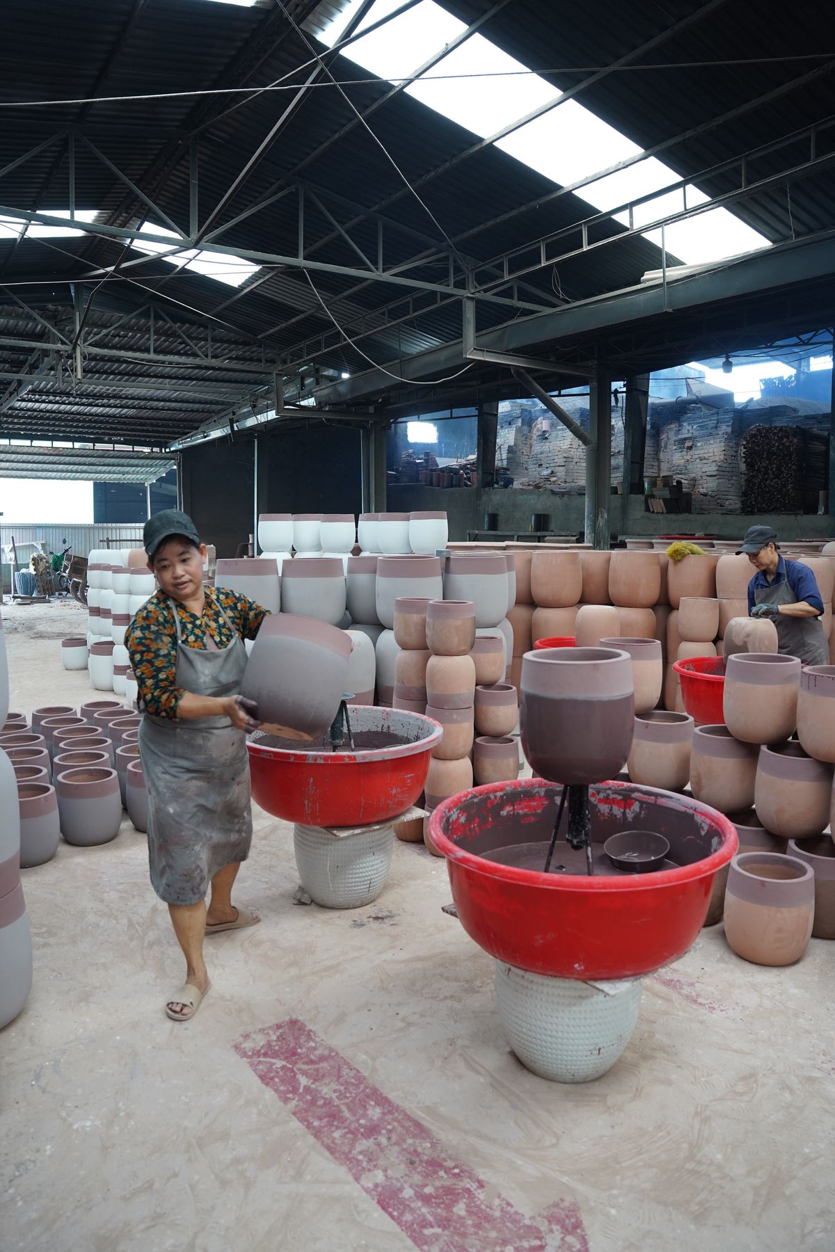 Our team glazing pots by hand, TNL & Son factory, Binh Duong, Vietnam